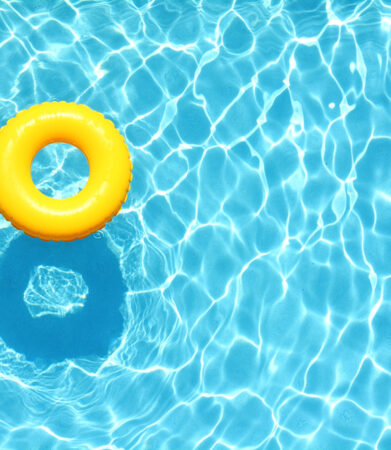 Yellow,Pool,Float,,Ring,Floating,In,A,Refreshing,Blue,Swimming