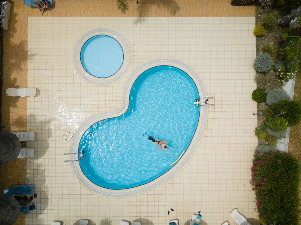 Aerial,Drone,Picture,About,A,Beautiful,,Blue,,outdoor,Swimming,Pool